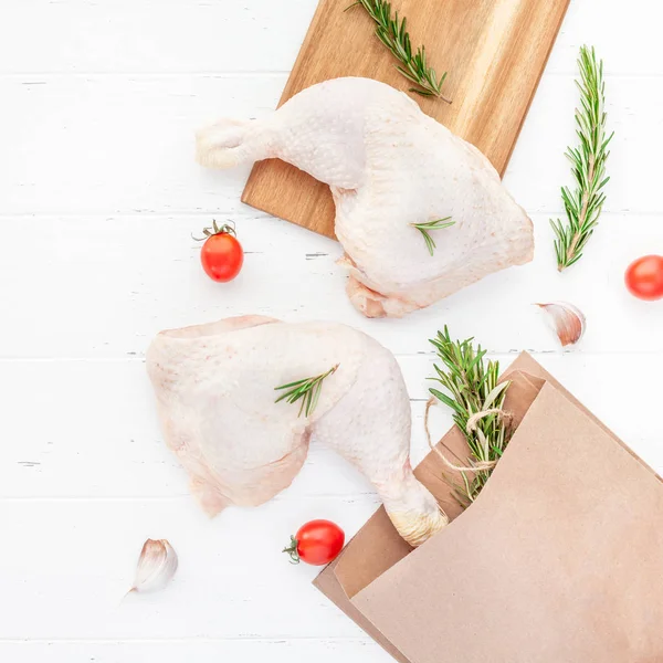 Fresh raw chicken legs with herbs. Cooking concept