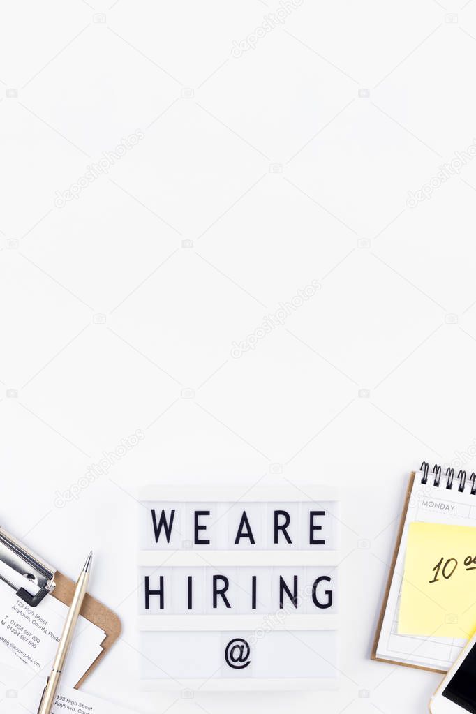 We are hiring flat lay on white background