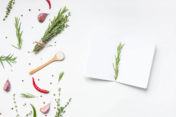 Blank notepad pages with greens herbs and spices — Stock Photo, Image