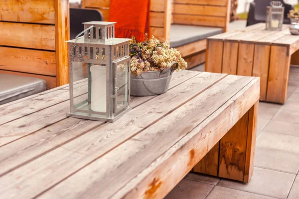 Outdoor restaurant terrace with wooden furniture