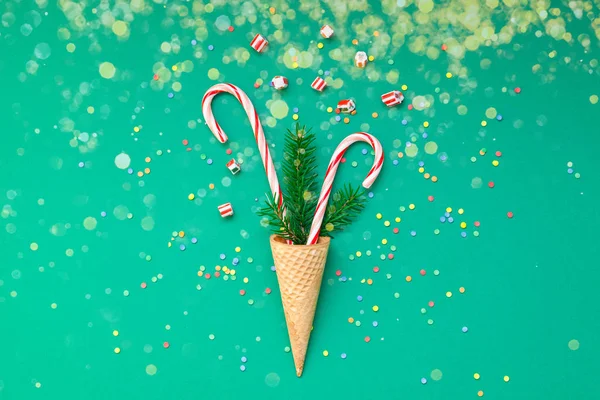 Christmas card with candy canes in waffle cone