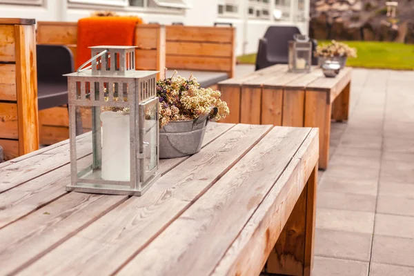 Outdoor restaurant terrace with wooden furniture — Stock Photo, Image