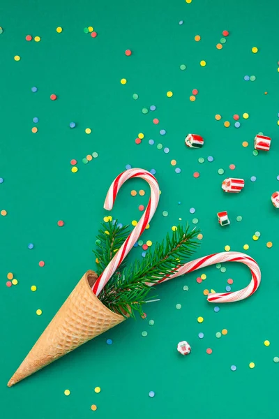 Christmas card with candy canes in waffle cone