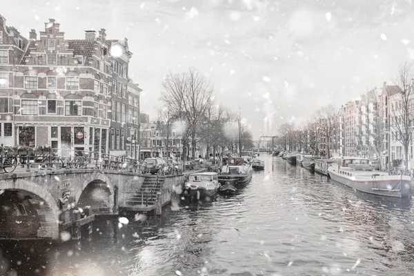 Amsterdam dull view in winter snowfall — Stock Photo, Image