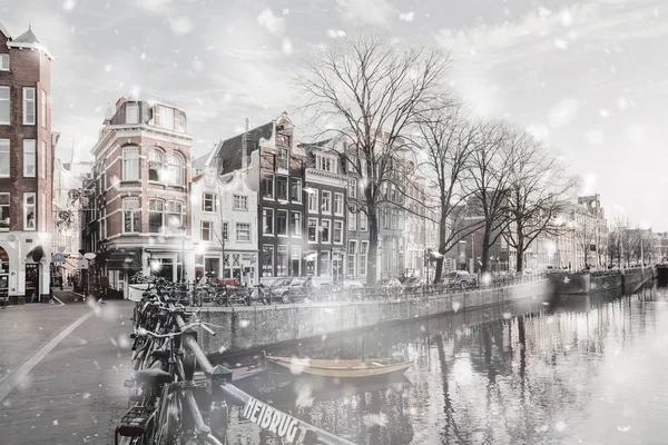 Amsterdam dull view in winter snowfall — Stock Photo, Image