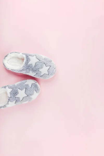 Soft fluffy slippers on pink background — Stock Photo, Image