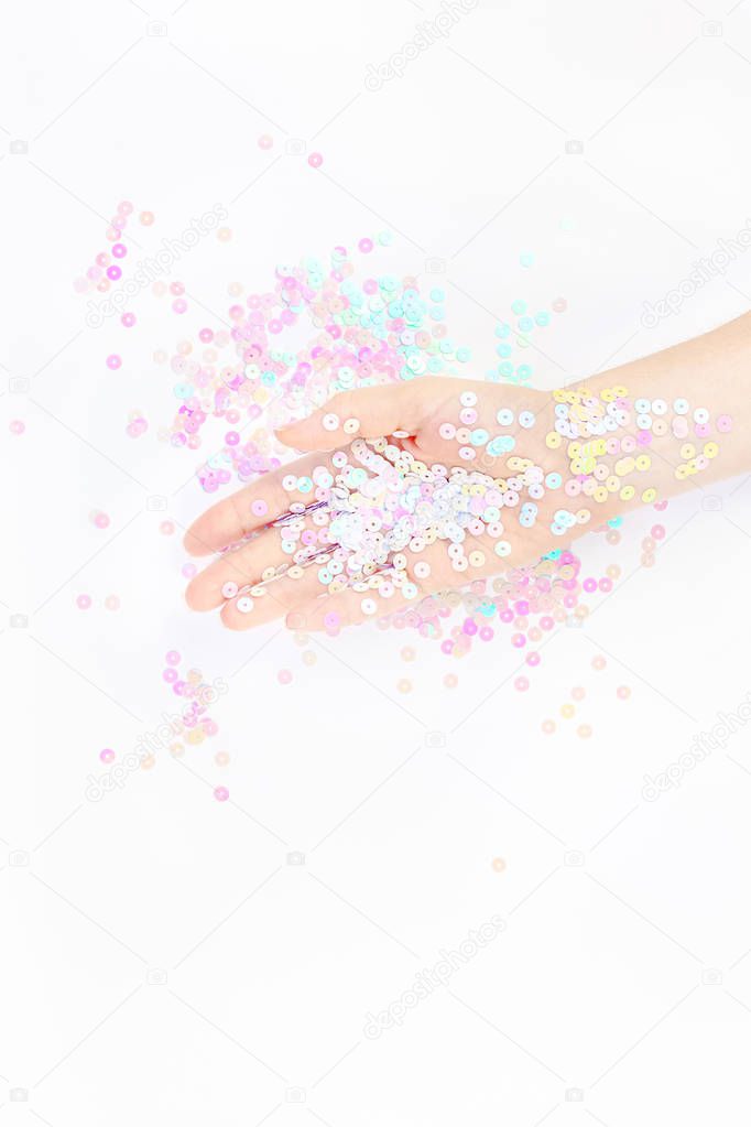 Pearl pastel confetti sparkles with woman hand