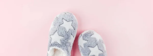 Soft fluffy slippers on pink background — Stock Photo, Image