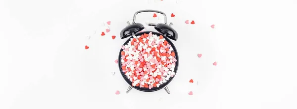 Valentine Day concept with alarm clock and hearts — Stock Photo, Image