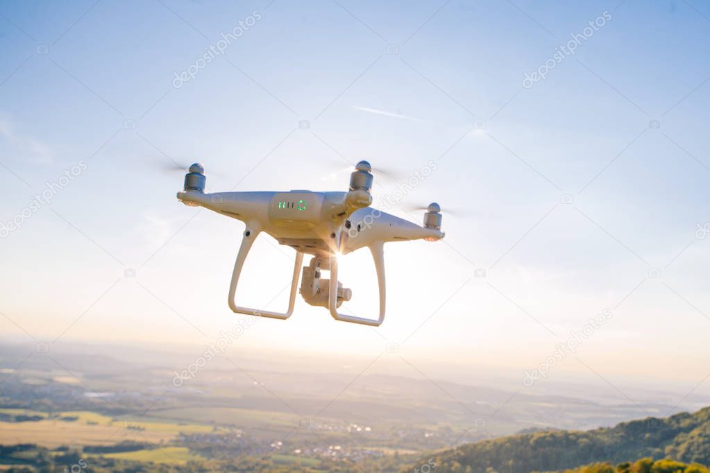 copter drone flying at sunset in hohenzollern castle area, Germany