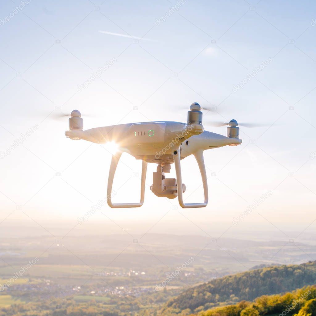 copter drone flying at sunset in hohenzollern castle area, Germany