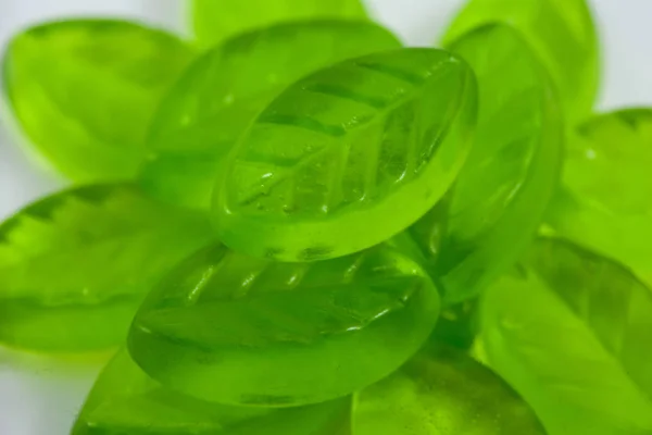 Green leaf form jelly candies background