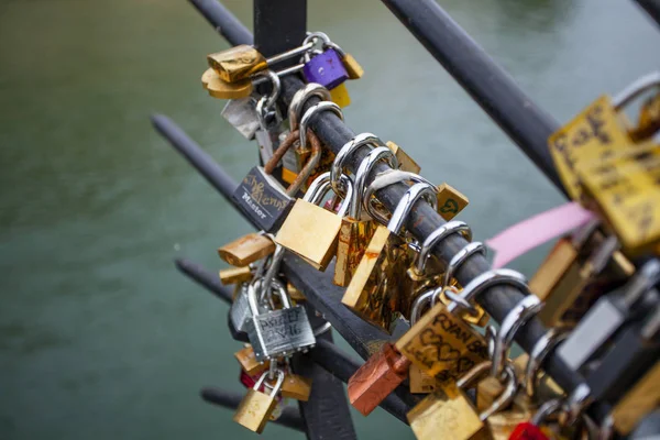 stock image PARIS, FRANCE -OCTOBER 1, 2016: Love Padlocks at Pont de l'Archevche in Paris. The thousands of locks of loving couples symbolize love forever.