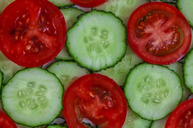 Dilimlenmiş salatalık ve domates arka plan