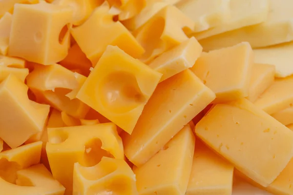 Asortyment różnego rodzaju holland ser, tło — Zdjęcie stockowe