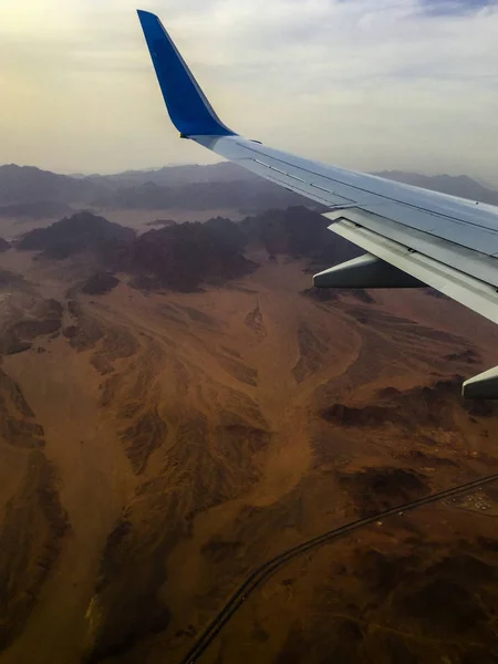 Airplane above the desert Sinay , preparing to  -  land at Sharm