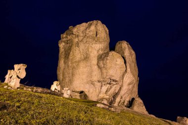 Night view to devil's rock in Pidkamin, Lviv region, West Ukraine summer landscape  clipart