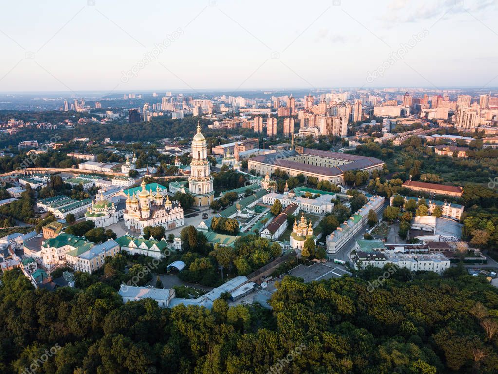 Aerial top view of Kiev Pechersk Lavra churches on hills from above, cityscape of Kyiv city at sunrise, Ukraine
