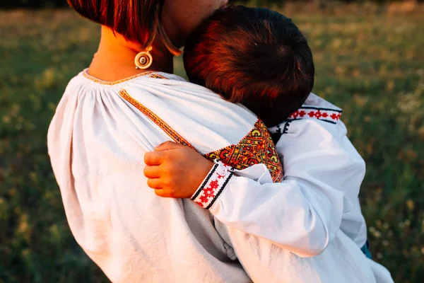 Family Mother Carries Boy Dressed Embroidered Robes Field Sunset — Stock Photo, Image