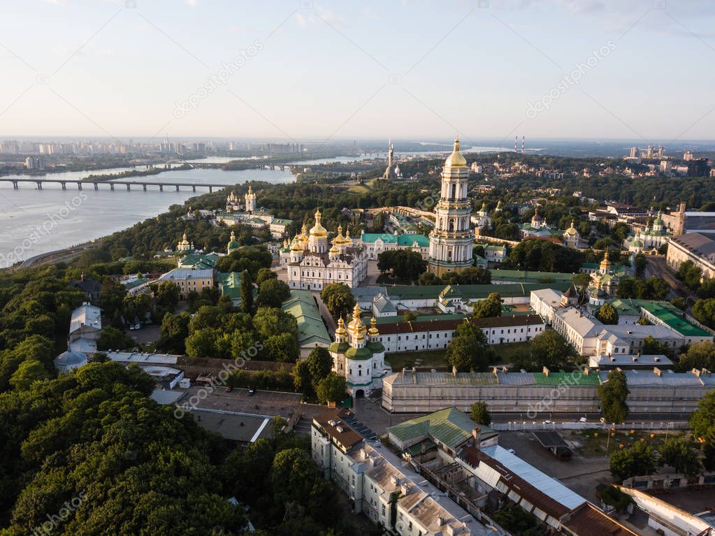 Famous ukranian landscape - aerial panoramic view of Kiev Pechersk Lavra churches on hills from above, cityscape of Kyiv city at sunrise, Ukraine