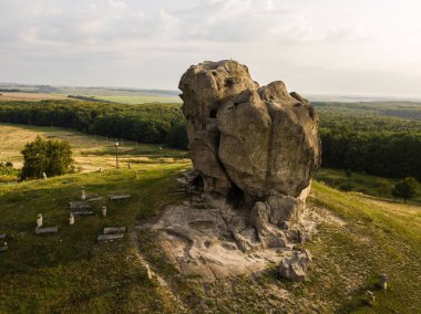 Famous ukranian sightseeing - aerial view to Devil's rock in Pidkamin, Brody district, Lviv region clipart