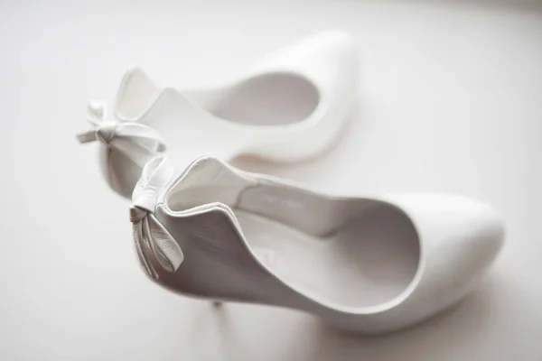 Gorgeous wedding shoes in heels on a white background