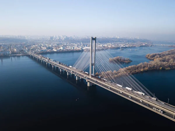 Aerial of the south bridge, city Kyiv Ukraine. South Bridge city of Kiev. The river of the Dnieper, the bridge crosses the river. City landscape from a bird\'s eye view bridge on river