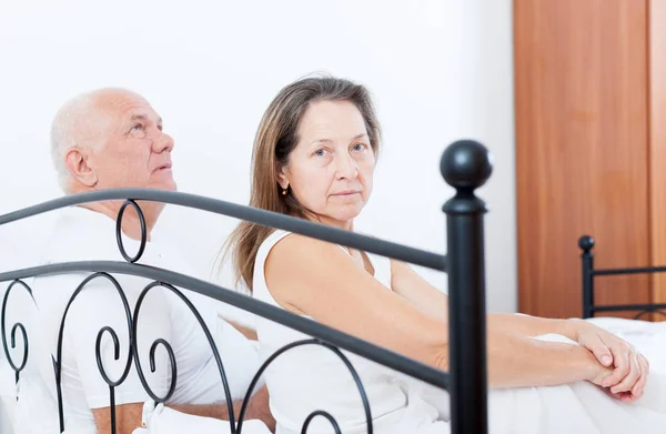 Sad Mature Woman Turned Away Elderly Man Sitting Bed — Stock Photo, Image