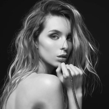 Young beautiful blonde with silver necklace 