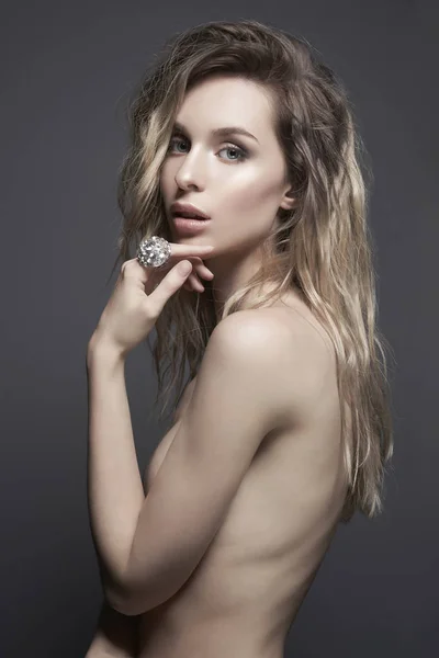 Young beautiful blonde with silver jewelry — Stok fotoğraf