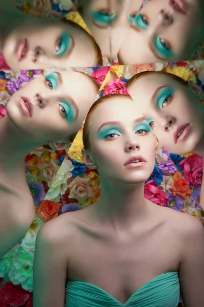 Mujer hermosa joven con maquillaje colorido brillante en flor bac —  Fotos de Stock