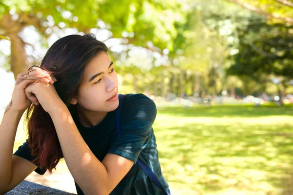 Biracial Asian Teen Girl Sitting Outdoors Picnic Table Grassy Park — Stock Photo, Image