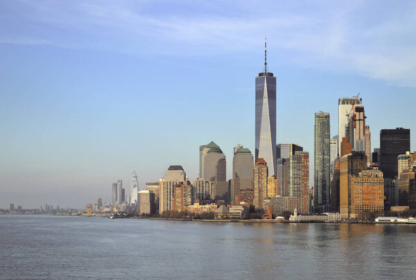 View of Lower Manhattan skyline at sunset time.
