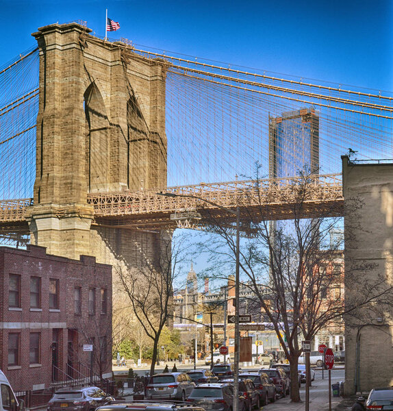 View of tower of Brooklyn Bridge at sunny day.