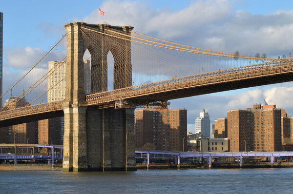 View of the Brooklyn Bridge at sunset time.