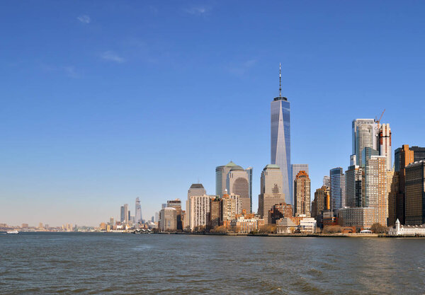 View of Lower Manhattan skyline at sunset time.