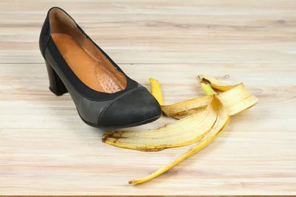 stock image Fall on a banana skin on wooden board