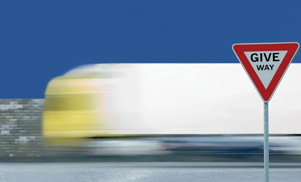 Give Way Text Yield Road Sign Motion Blurred Truck Vehicle — Stock Photo, Image