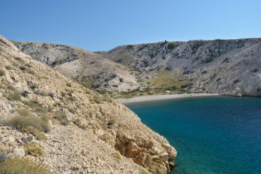 Gravel beach in the Vela Draga bay on the island Krk, Croatia clipart