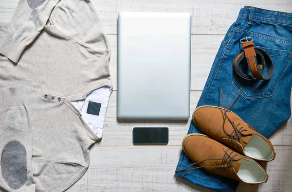 View Wooden Table Laptop Smartphone Belt Shoes Jeans Pullover — Stock Photo, Image