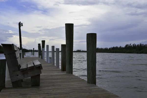 Bench seating on a pier in florida — Stock Photo, Image