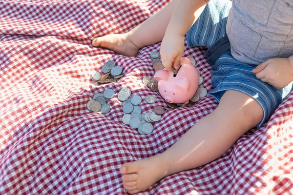 Baby Boy Sitting Picnic Blanket Putting Coins Piggy Bank — Stock Photo, Image