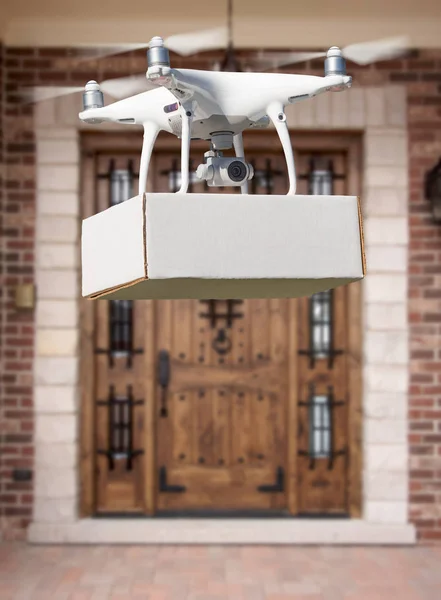 Unmanned Aircraft System (UAV) Quadcopter Drone Delivering Package At House.