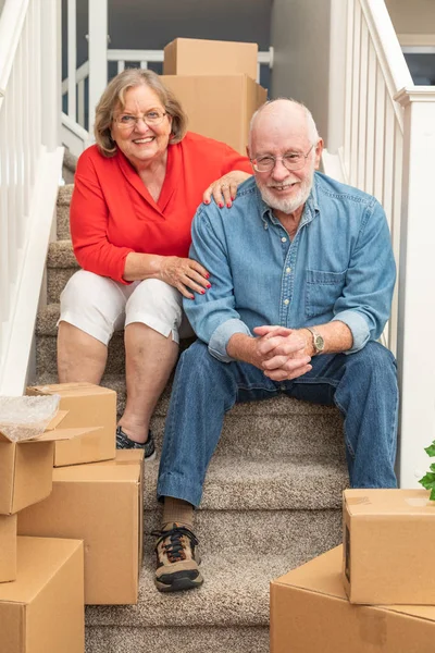 Senior Couple Resting Stairs Surrounded Moving Boxes — Stock Photo, Image