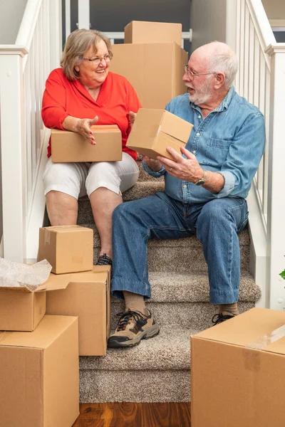 Senior Couple Resting Stairs Surrounded Moving Boxes — Stock Photo, Image