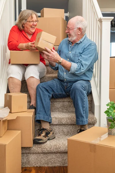 Senior Couple Resting Stairs Surrounded Moving Boxes — Stock Photo, Image