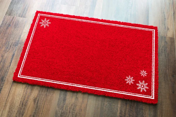 Blank Holiday Red Welcome Mat Snow Flakes Wood Floor Background — стоковое фото