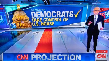 Washington, DC / United States, November 6, 2018: Wolf Blitzer on CNN Announcing Democrats Take Control of the U.S. House of Representatives in the Midterm Elections. clipart