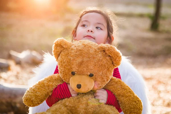 Cute Young Mixed Race Baby Girl Hugging Teddy Bear Outdoors — Stock Photo, Image