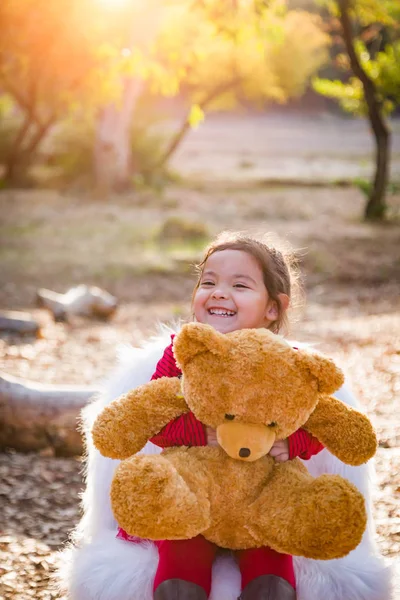 Cute Young Mixed Race Baby Girl Hugging Teddy Bear Outdoors — Stock Photo, Image